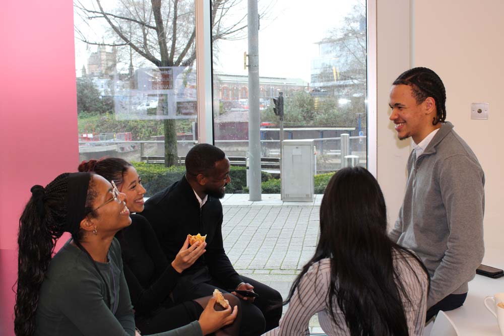 Group of individuals in discussion in a casual setting